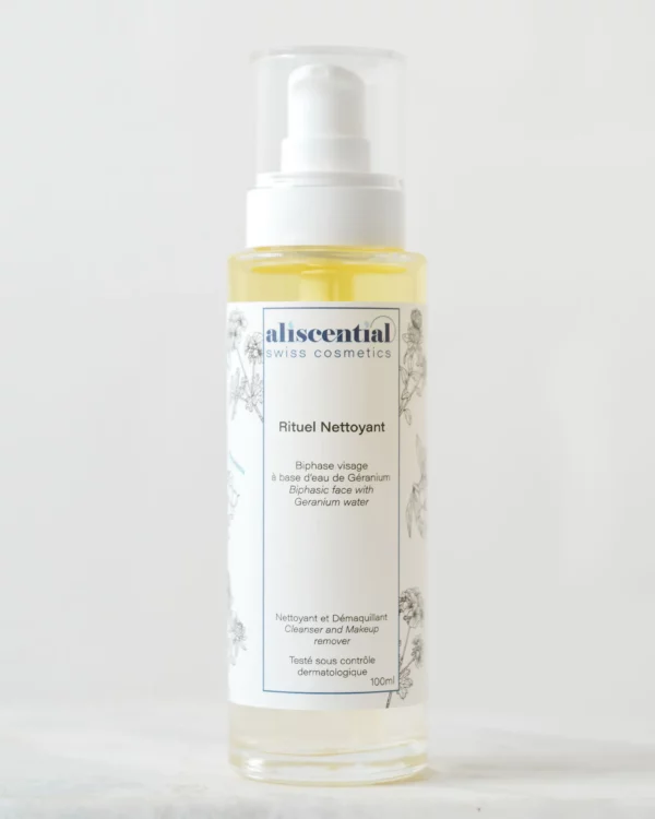 Bottle of Aliscential Rituel Nettoyant, a biphasic facial cleanser and makeup remover with geranium water to gently remove makeup and impurities.